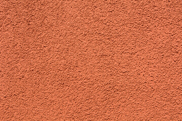 Orange terracotta plastered wall with copyspace