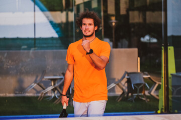 Padel player exulting after winning a match - Young athlete celebrating victory after good play