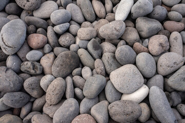 Tenerife, Spain. Pebbles on a beach on the island of Tenerife. Suitable as wallpaper pattern.