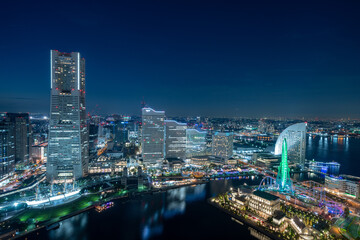 Fototapeta premium Yokohama Minato Mirai 21 seaside urban area in central Yokohama with Landmark tower at Magic hour