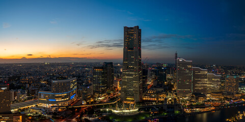 Obraz premium Yokohama Minato Mirai 21 seaside urban area in central Yokohama with Landmark tower at Magic hour