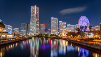 Naklejka premium Yokohama Minato Mirai 21 seaside urban area in central Yokohama with Landmark tower at Magic hour