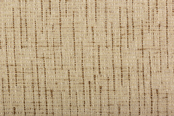 Factory fabric with brown and white threads interspersed. Close-up long and wide texture of natural fabric. Fabric texture of natural cotton or linen textile material.