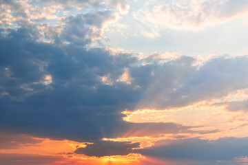Beautiful dramatic sky at sunset. Blue and orange colors of the sky.