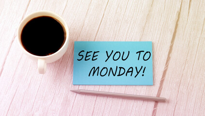 SEE YOU TO MONDAY text on the blue sticker with cofee and pen
