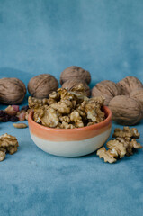 dried fruits, nuts on a light blue background with space to put information