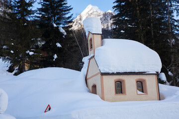 snowbound chapel in the mountains