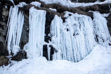Frozen waterfall in the mountains 