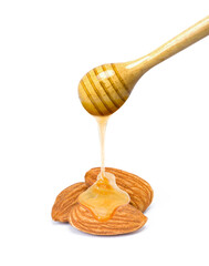 Almond nut with honey dripping on white