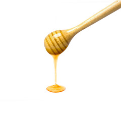 honey dripping from a wooden dipper