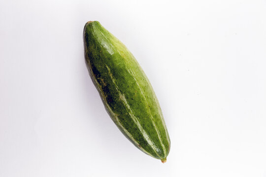 Whole pointed gourds or potol or parwal green vegetable isolated on white background. top view. close up