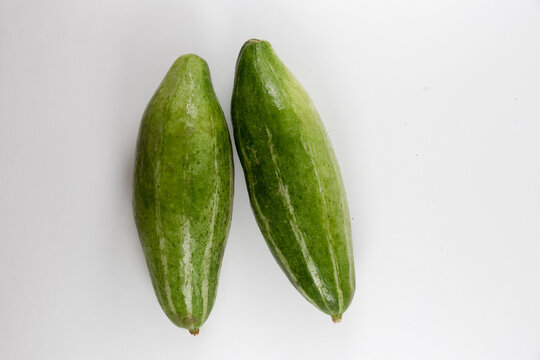 Whole pointed gourds or potol or parwal green vegetable isolated on white background. top view. close up