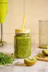 Green smoothie made from kiwi and pea sprouts.