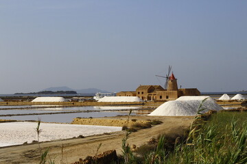 Mill in the salt flats of Marsala on a summer day, Trapani, Sicily, Italy