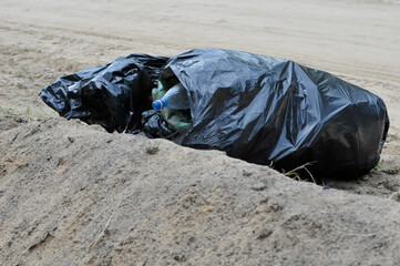 Plastic bags with garbage on the sand