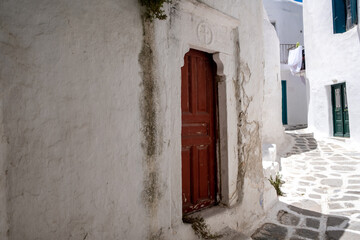 Fototapeta na wymiar Mykonos island, Old church entrance door at Chora town. Greece, Cyclades.