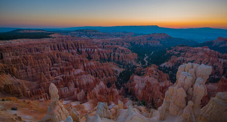 Beautiful landscape. Green pine-trees on rock slopes. Scenic view of the canyon. Bryce Canyon National Park. Utah. USA