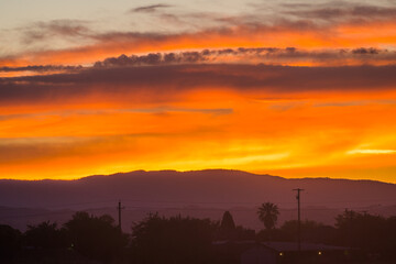 Fototapeta premium Amazing sunset with red sky over the hills. California. USA