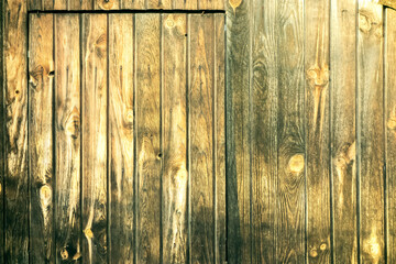 A wooden wall with an aged surface.
Vintage wall and floor made of darkened wood, realistic plank texture.
 Empty room interior background.