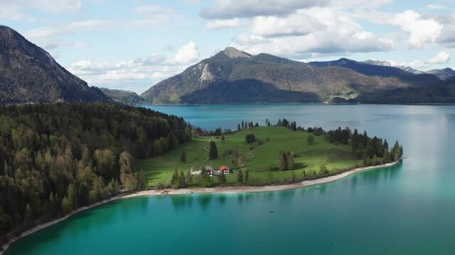 Lake Walchensee in Bavarian Alps from above with white clouds in blue sky, Bavaria
