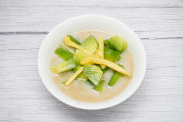 Thai dessert, melon and yellow jackfruit Topped with sugar syrup, fresh coconut milk and pandan leaves add aroma