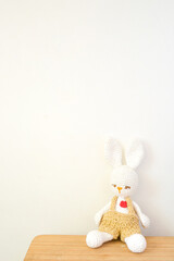 knitted toy rabbit with white background