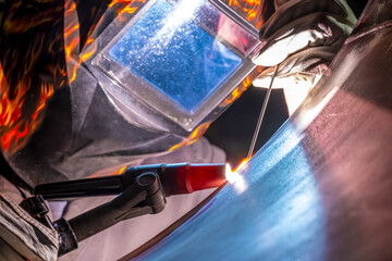 TIG welding. Welding of stainless steel pipe by electric arc welding, non-melting tungsten...