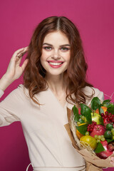 beautiful woman smile posing fresh fruits bouquet emotions pink background