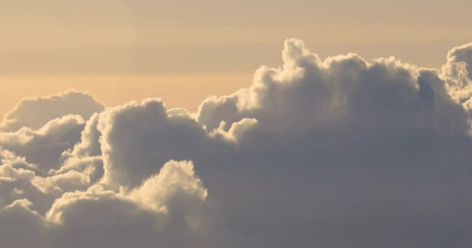Right to left panning footage above the cloud line at sunset on the island of Maui, Hawaii, USA