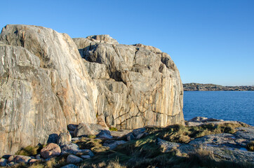 Blue sky, sea, nice cliffs. View of the archipelago in northern Gothenburg. A beautiful sunny day in Sweden. Place for text, copy space.	