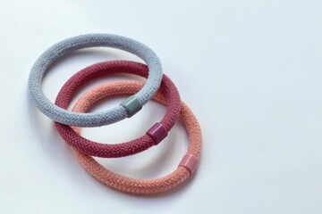 Three pastel color elastic rubber hair band, accessory for long hair.