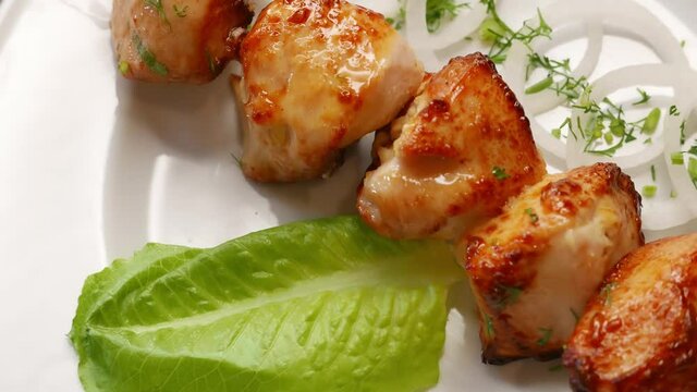 Chicken barbecue shish kebab for dinner. Nice grilled meat food rotating