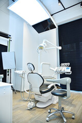 Dental office with chair and equipment.
