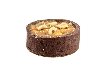 Mini caramel tart with hazelnuts isolated on white