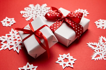 Christmas gift boxes with white snowflakes on red