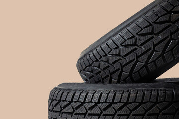 Winter car tires. Group of tires for winter driving on a blue background.