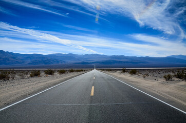 Road disappearing into the distance, in Death Valley from Panamint Springs, California