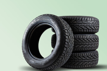 Winter car tires. Group of tires for winter driving on a blue background.