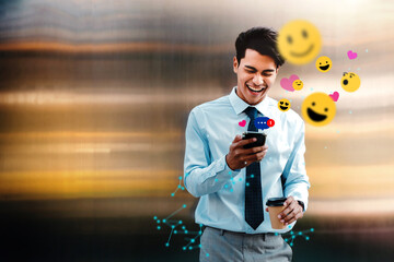 Cheerful Young Asian Businessman Using Mobile Phone in the City. Enjoying Social Media application. surrounded by many icons