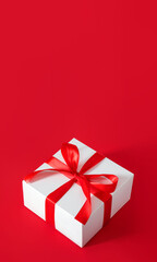 gift white box with red bow christmas background with place for text