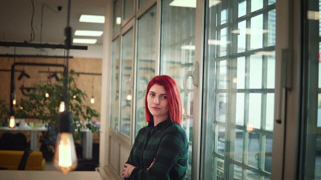 Portrait of young female developer as a successful independent businesslady posing in a modern office. Business, start up, development and feminisam concept