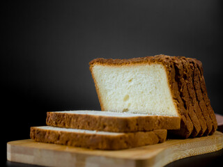slices of bread on a black background
