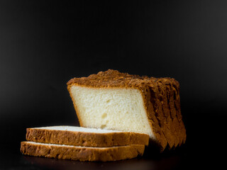 slices of bread on a black background