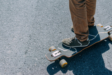 Feet on a skateboard.