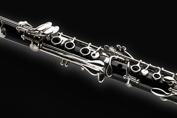 Chaves de clarinete visto na diagonal em fundo fundo preto - obrazy, fototapety, plakaty
