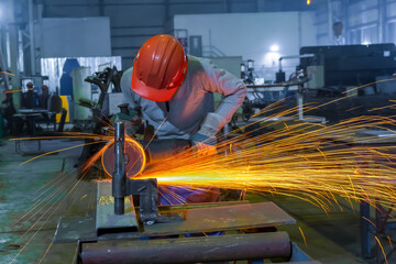Rotation of the angle grinder disc during operation. Bright sparks from metal cutting. Preparation...