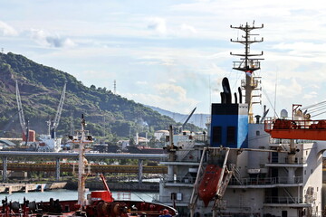 Cargo terminal for unloading steel plates from bulk carrier by ships cranes.  Port of Cigading....