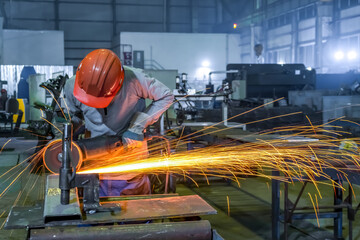 Rotation of the angle grinder disc during operation. Bright sparks from metal cutting. Preparation...