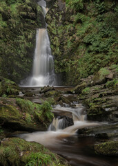 Fototapeta premium Stunning long exposure landscape early Autumn image of Pistyll Rhaeader waterfall in Wales, the tallest waterfall in UK