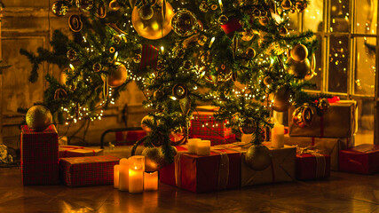 Christmas and New Year interior decoration. Green tree decorated with toys, gifts, present boxes, flashing garland, illuminated lamps. Fireplace and xmas tree. Cozy Christmas atmosphere